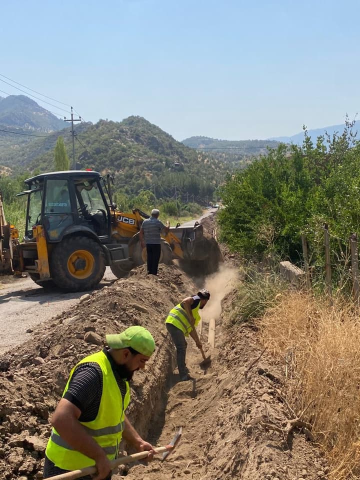 Excavator digging a trench