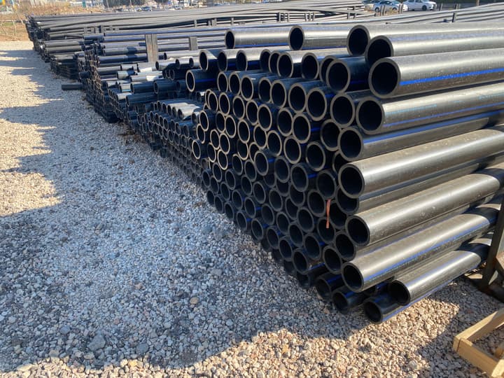 HDPE pipes stacked in a storage yard